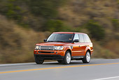 AUT 29 RK0875 01
2006 Range Rover Supercharged Orange 3/4 Front View On Road In Motion