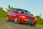 AUT 29 RK0880 01
2006 Audi, A4, 2.0 T, Red Low 3/4 Front View On Road In Motion By Grass Hills