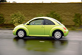 AUT 29 RK1157 01
2005 VW Beetle Green Profile Shot On Wet Road In Motion