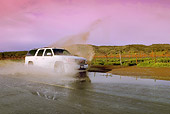AUT 29 RK1165 01
2005 GMC Yukon XL Denali White 3/4 Front View On Wet Road In Motion