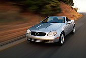 AUT 29 RK0003 01
1998 Mercedes-Benz SLK Kompressor Silver 3/4 Front View On Road In Motion