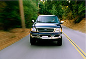 AUT 29 RK0006 03
1997 Ford Expedition Blue Head On View On Road In Motion By Trees