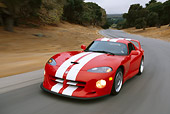 AUT 29 RK0007 36
1997 Dodge Hennessey Viper Venom 600 GTS Red White Stripe 3/4 Front View On Road In Motion By Trees