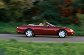 AUT 29 RK0041 10
1997 Jaguar XK8 Convertible Red Profile View On Road In Motion