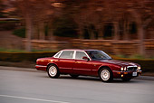 AUT 29 RK0046 01
1998 Jaguar XJ8 Red 3/4 Side View On Road In Motion