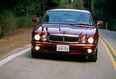 AUT 29 RK0048 32
1998 Jaguar XJ8 Red Head On View On Road In Motion By Trees