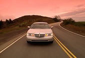 AUT 29 RK0084 10
1998 Lincoln Town Car Silver Head On View On Road In Motion