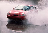 AUT 29 RK0114 01
1998 Ford Taurus GL Red 3/4 Front View Splashing Water In Motion