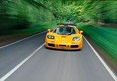 AUT 29 RK0125 14
1996 McLaren F1 LM Orange Head On View On Road In Motion