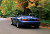 AUT 29 RK0165 02
1999 BMW M Roadster Z3 Convertible Blue 3/4 Rear View On Road In Motion