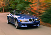 AUT 29 RK0177 01
1999 BMW M Roadster Z3 Convertible 3/4 Front View On Road By Trees