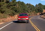 AUT 29 RK0208 01
1999 Ford F150 Lariat Triton V8 Red Head On View On Road In Motion By Trees