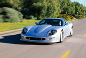 AUT 29 RK0282 01
1998 Chevrolet Callaway C12 Corvette Silver 3/4 Front View On Road In Motion By Trees