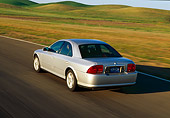 AUT 29 RK0302 01
2000 Lincoln LS Sport Sedan Silver On Road In Motion Rear 3/4 View