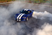 AUT 29 RK0332 11
Overhead Shot Of A 1997 Dodge Viper Blue White Stripe Burning Out With Lots Of Smoke