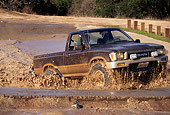 AUT 29 RK0379 11
1981 Toyota 4x4 Pickup Truck In Motion Driving Through Mud