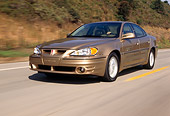 AUT 29 RK0444 02
1999 Pontiac Grand Am Gold Low 3/4 Front View On Road In Motion