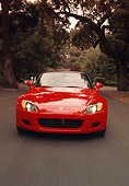 AUT 29 RK0467 01
2000 Honda S2000 Convertible Red Head On View On Road In Motion By Trees
