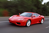 AUT 29 RK0495 01
1999 Ferrari 360 Modena Red In Motion On Road 3/4 Front View Trees