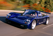 AUT 29 RK0512 12
2000 Ultima GTR Blue 3/4 Front View On Road In Motion Blurry Trees