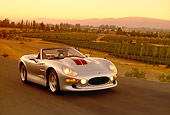 AUT 29 RK0567 03
1999 Shelby Series 1 Convertible Silver 3/4 Front View On Road In Motion Filtered