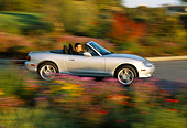 AUT 29 RK0571 02
2001 Mazda Miata Convertible Silver 3/4 Rear View On Road In Motion