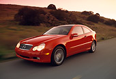 AUT 29 RK0593 18
2002 Mercedes-Benz C230 Kompressor Red 3/4 Front View On Road In Motion