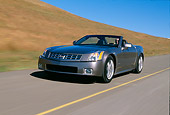 AUT 29 RK0597 14
2004 Cadillac XLR Convertible Shale Metallic Front 3/4 View In Motion Grass Hills
