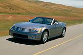 AUT 29 RK0597 22
2004 Cadillac XLR Convertible Shale Metallic Front 3/4 View In Motion Grass Hills