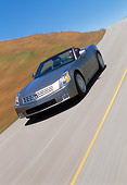 AUT 29 RK0600 24
2004 Cadillac XLR Convertible Silver Slanted 3/4 Front View On Road In Motion