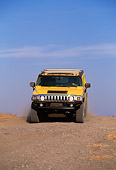 AUT 29 RK0617 01
2003 GM H2 Hummer Yellow Head On Dirt Hill Blue Sky
