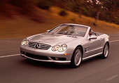 AUT 29 RK0628 01
2003 Mercedes-Benz SL55 AMG Roadster Silver 3/4 Front View On Road In Motion