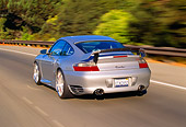 AUT 29 RK0658 11
2004 Porsche X50 Turbo Silver 3/4 Rear View On Road In Motion