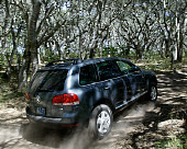 AUT 29 RK0663 01
2004 Volkswagen Touareg Blue On Dirt Road In Motion