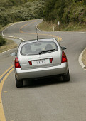 AUT 29 RK0720 01
2004 Nissan Primera Silver Station Wagon Rear View On Twisty Road