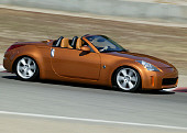 AUT 29 RK0806 01
2004 Nissan 350Z Convertible Orange 3/4 Front View On Racetrack