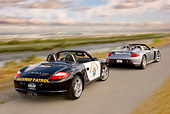 AUT 29 RK0876 01
2005 Porsche Boxster S Police Car Chasing 2005 Porsche Carerra GT Silver On Road