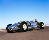 AUT 29 RK0878 01
2005 Blastolene, Indy Special, Silver, 3/4 Side View In Motion With Driver