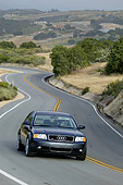 AUT 29 RK0956 01
2004 Audi A6 Blue 3/4 Front View On Road In Motion On Hill