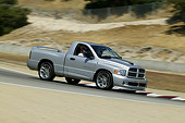 AUT 29 RK0958 01
2004 Dodge SRT-10 Truck Silver 3/4 Front View On Track In Motion