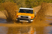 AUT 29 RK1060 01
2007 Toyota FJ Cruiser Yellow And White Head On Shot In Water In Motion