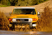 AUT 29 RK1061 01
2007 Toyota FJ Cruiser Yellow And White Head On Shot In Water In Motion