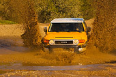 AUT 29 RK1062 01
2007 Toyota FJ Cruiser Yellow And White Head On Shot In Water In Motion