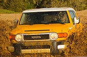 AUT 29 RK1063 01
2007 Toyota FJ Cruiser Yellow And White Head On Shot In Water In Motion