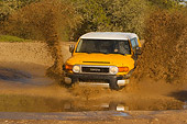 AUT 29 RK1064 01
2007 Toyota FJ Cruiser Yellow And White Head On Shot In Water In Motion