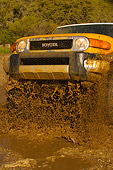 AUT 29 RK1067 01
2007 Toyota FJ Cruiser Yellow And White Low 3/4 Front View In Water In Motion