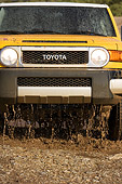 AUT 29 RK1070 01
2007 Toyota FJ Cruiser Yellow And White Low Head On View In Water In Motion