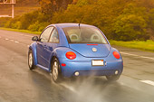 AUT 29 RK1158 01
2005 VW Beetle Blue 3/4 Rear Shot On Wet Road In Motion