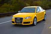 AUT 29 RK1202 01
2007 Audi RS4 Yellow 3/4 Front View On Road In Motion