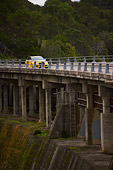 AUT 29 RK1239 01
2007 Audi RS4 Yellow Distant 3/4 Front View On Bridge In Motion